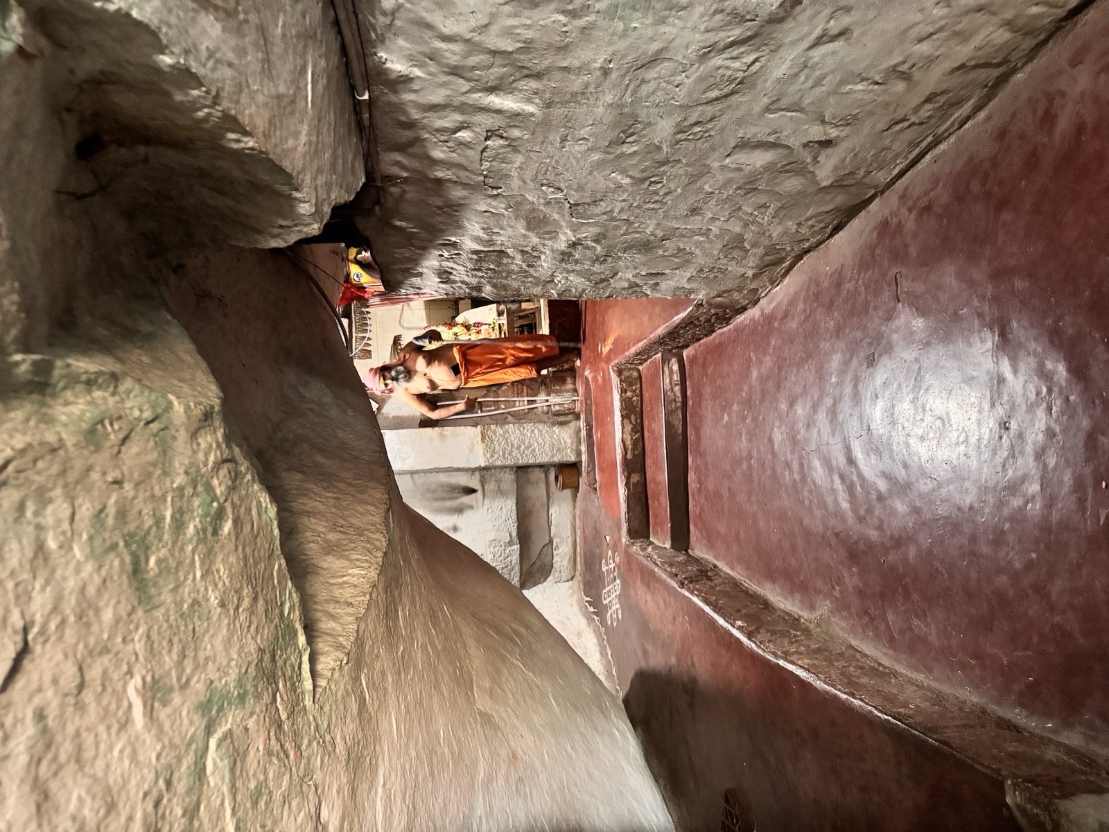The narrow stone corridor inside the Rishimukha cave